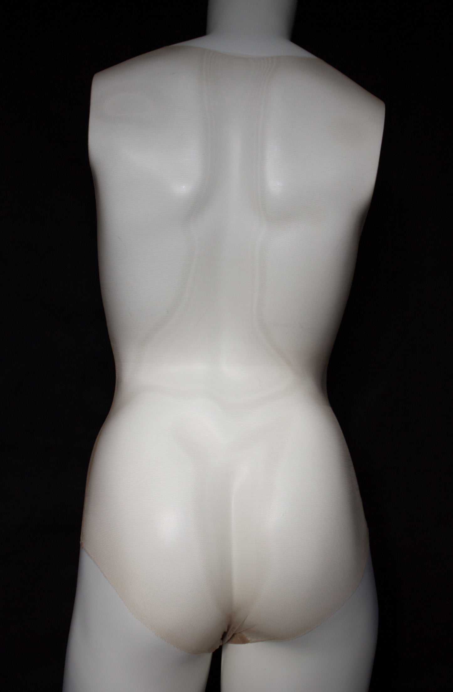 Mannequin torso on a black background